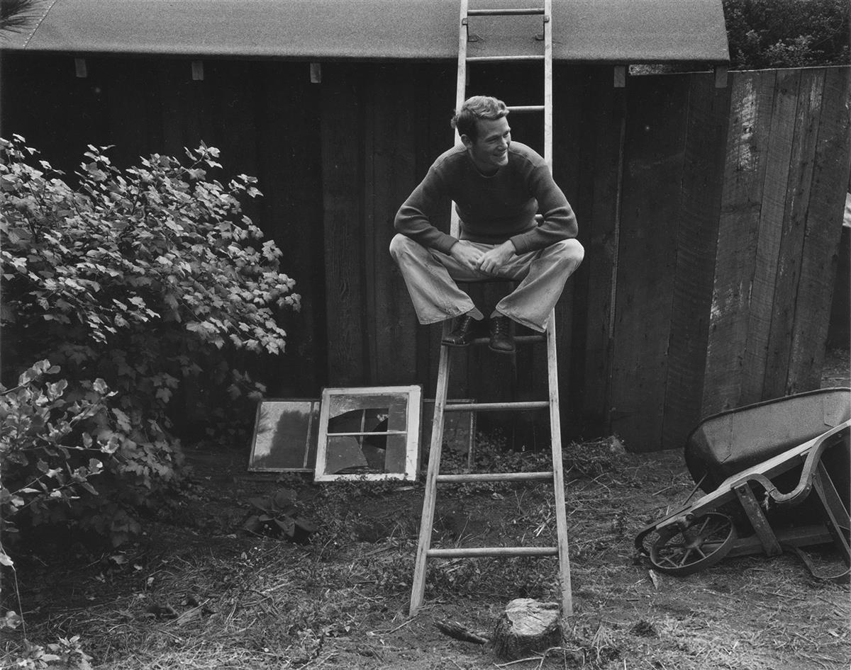 EDWARD WESTON (1886-1958)/BRETT WESTON (1911-1993) Portrait of Neil Weston (seated on ladder).